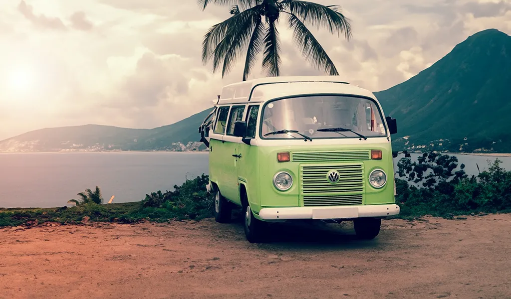 And old-school WV camper van on the beach
